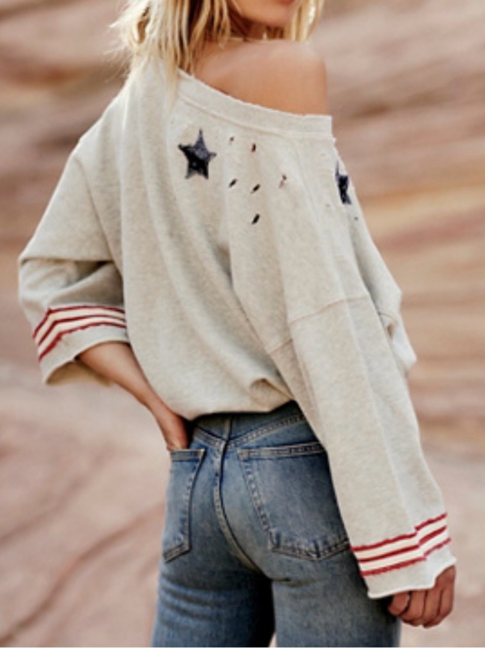 Free People Cream Off-Shoulder Star Detail Sweater with Red Stripe Cuffs